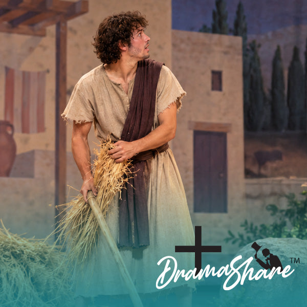 A man dressed as a rustic shepherd or prophet in a beige tunic with a dark brown sash stands holding a bundle of straw in front of a painted village backdrop. A large translucent teal overlay covers the lower half of the image, with a black cross and the white script logo 'DramaShare' at the bottom right.