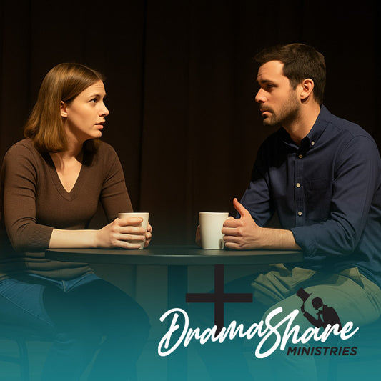 Two people sitting across from each other at a table with 'Drama Share Ministries' logo.