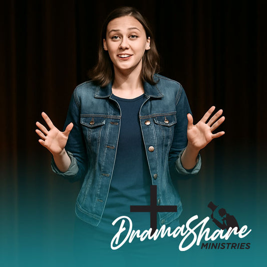 Young woman on stage delivering a monologue with expressive hand gestures, wearing casual clothing, standing before a dark curtain in warm stage lighting.